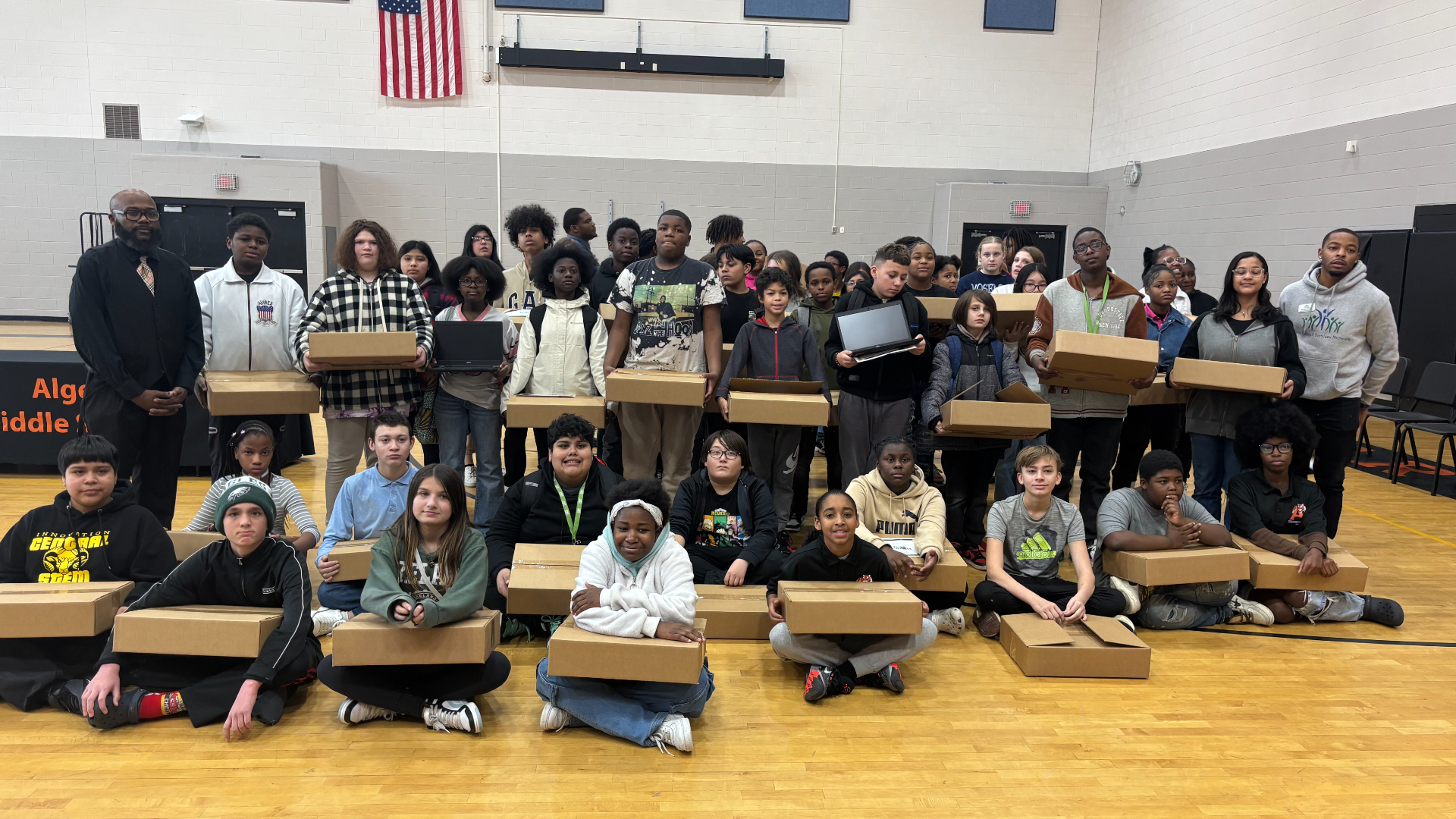 Alger Heights students receive free laptops. (Nov. 21, 2024)