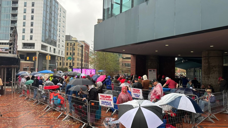 People wait in line outside Van Andel Arena in downtown Grand Rapids hours before former President Donald Trump's final campaign rally of 2024. (Nov. 4, 2024) 