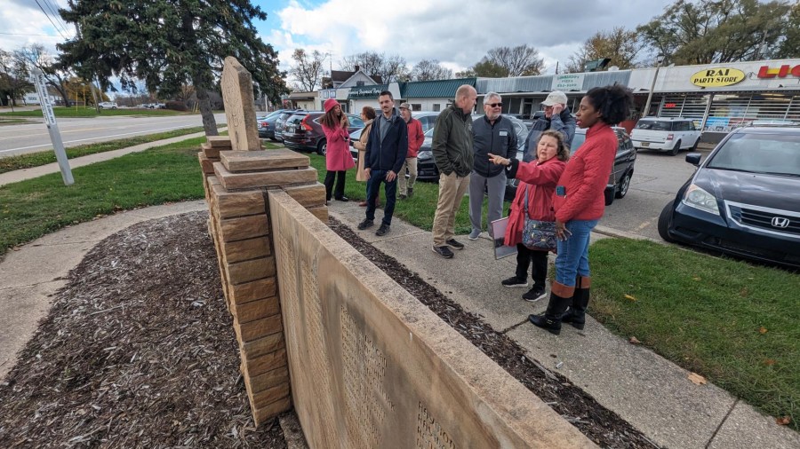 People stand in front of the veterans memorial wall in Wyoming. (Nov. 11, 2024)