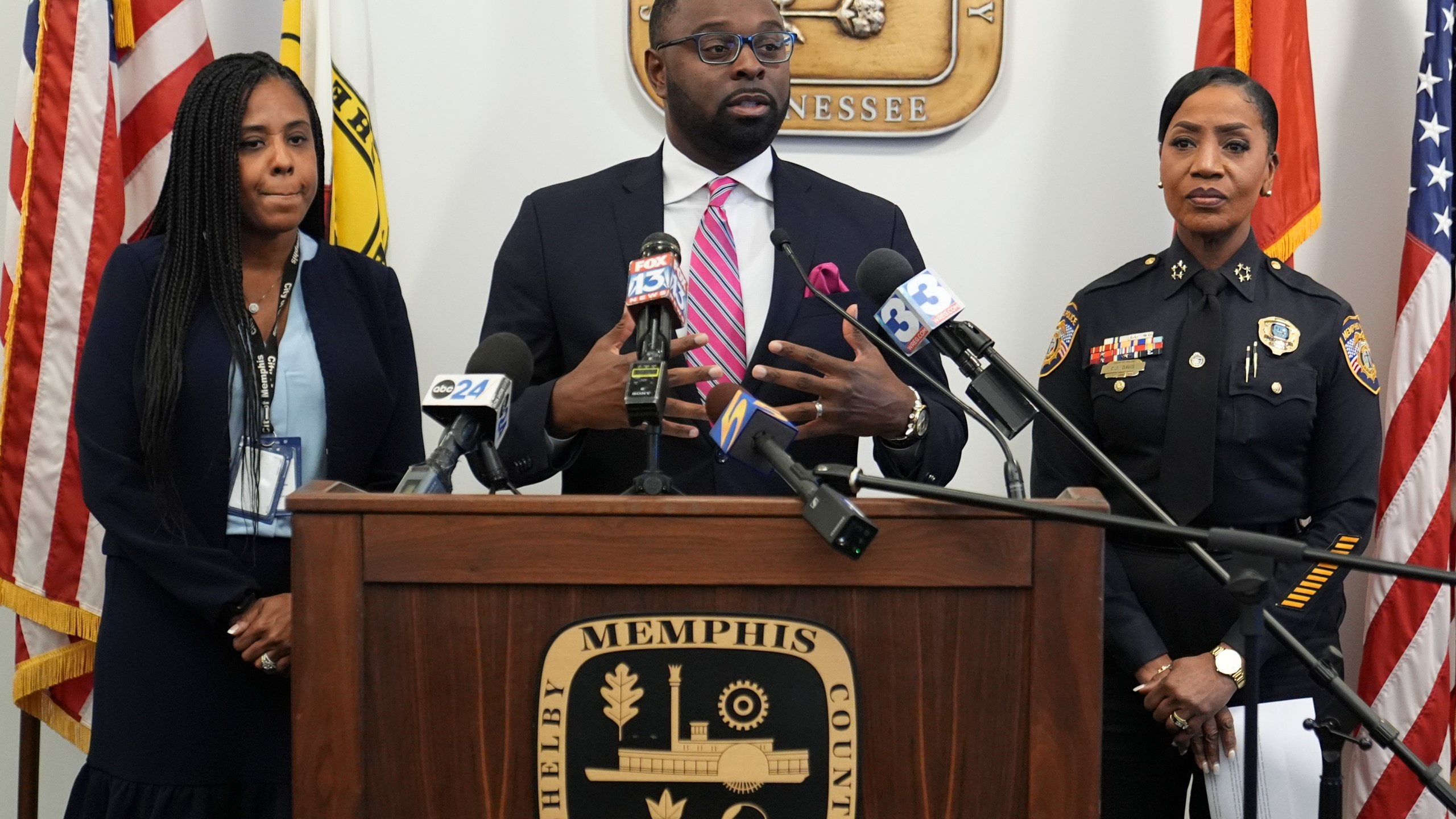 Mayor Paul Young, center, speaks during a news conference with Tannera Gibson, left, and Police Chief Cerelyn "C.J." Davis, right, Thursday, Dec. 5, 2024, in Memphis, Tenn. (AP Photo/George Walker IV)