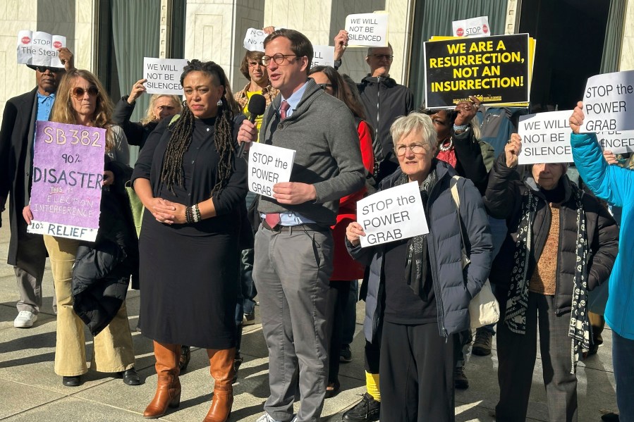 The Rev. Rob Stephens with the NC Poor People's Campaign speaks at a news conference outside the North Carolina Legislative Building in Raleigh, N.C. on Monday, Dec. 2, 2024. (AP Photo/Gary D. Robertson)