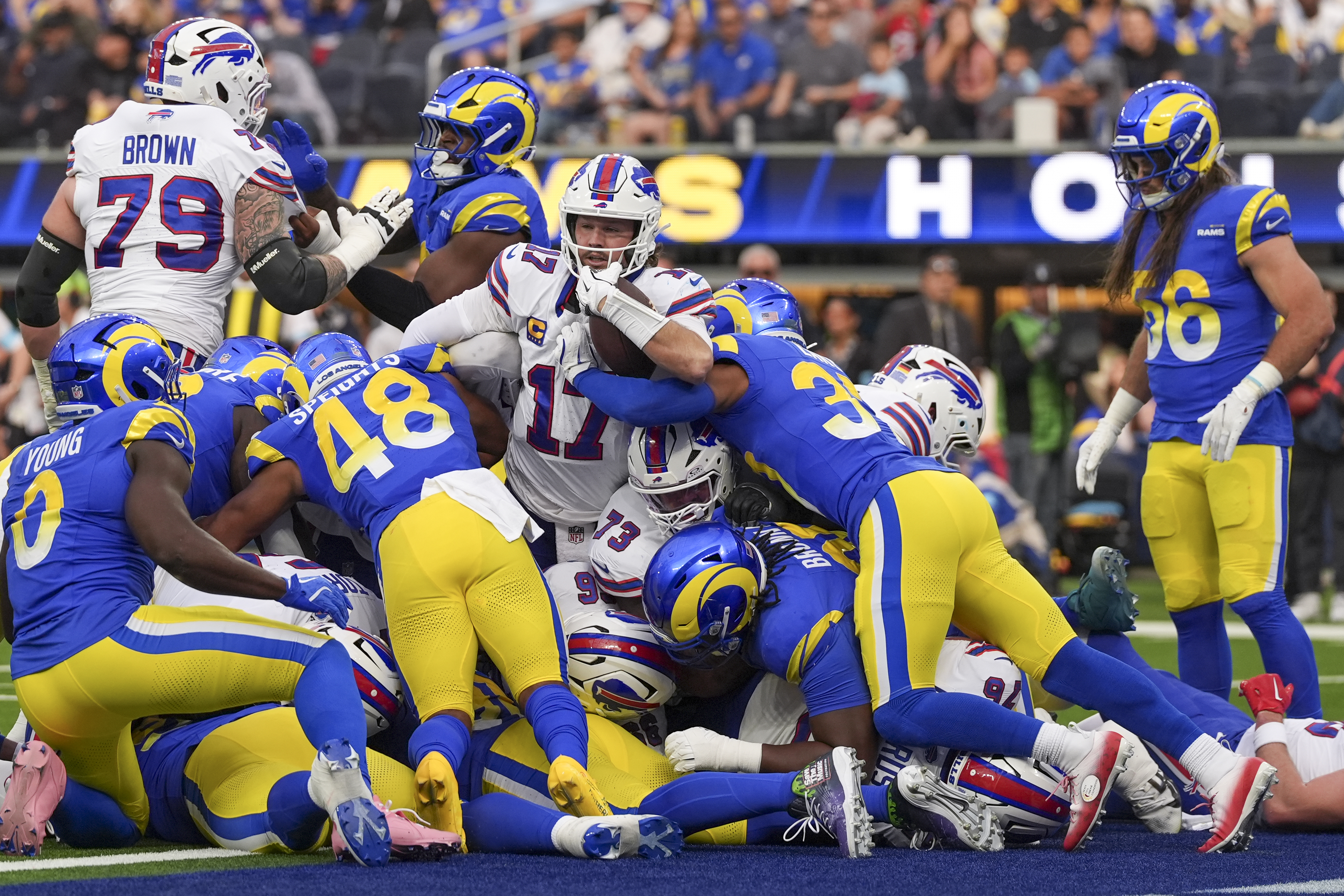 Buffalo Bills quarterback Josh Allen, center, scores a touchdown on a keeper against the Los Angeles Rams during the first half of an NFL football game, Sunday, Dec. 8, 2024, in Inglewood, Calif. (AP Photo/Gregory Bull)