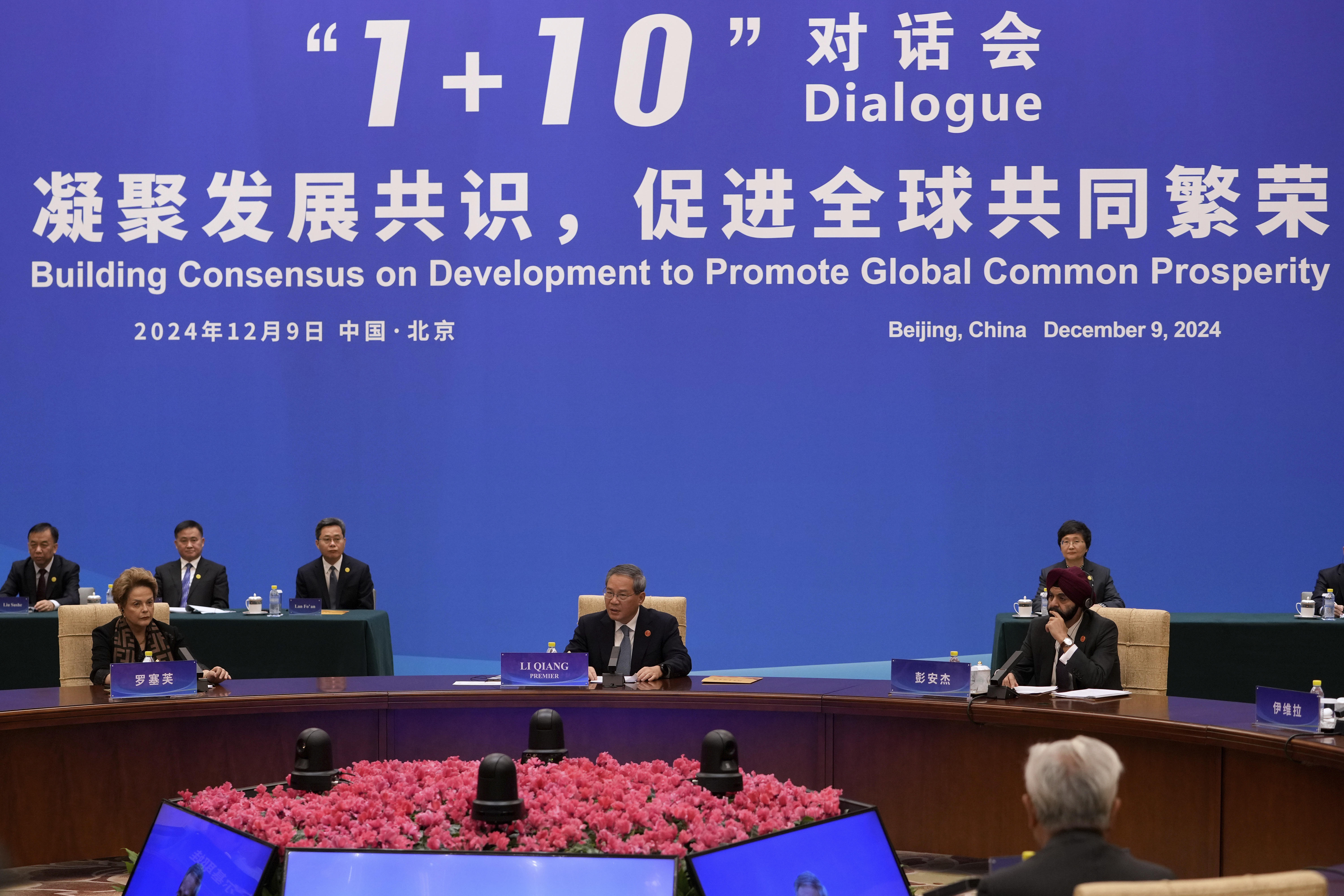 Chinese Premier Li Qiang, center, speaks as he chairs the "1+10" Dialogue on Building Consensus on Development to Promote Global Common Prosperity, at the Diaoyutai State Guesthouse in Beijing, Monday, Dec. 9, 2024. (AP Photo/Andy Wong)