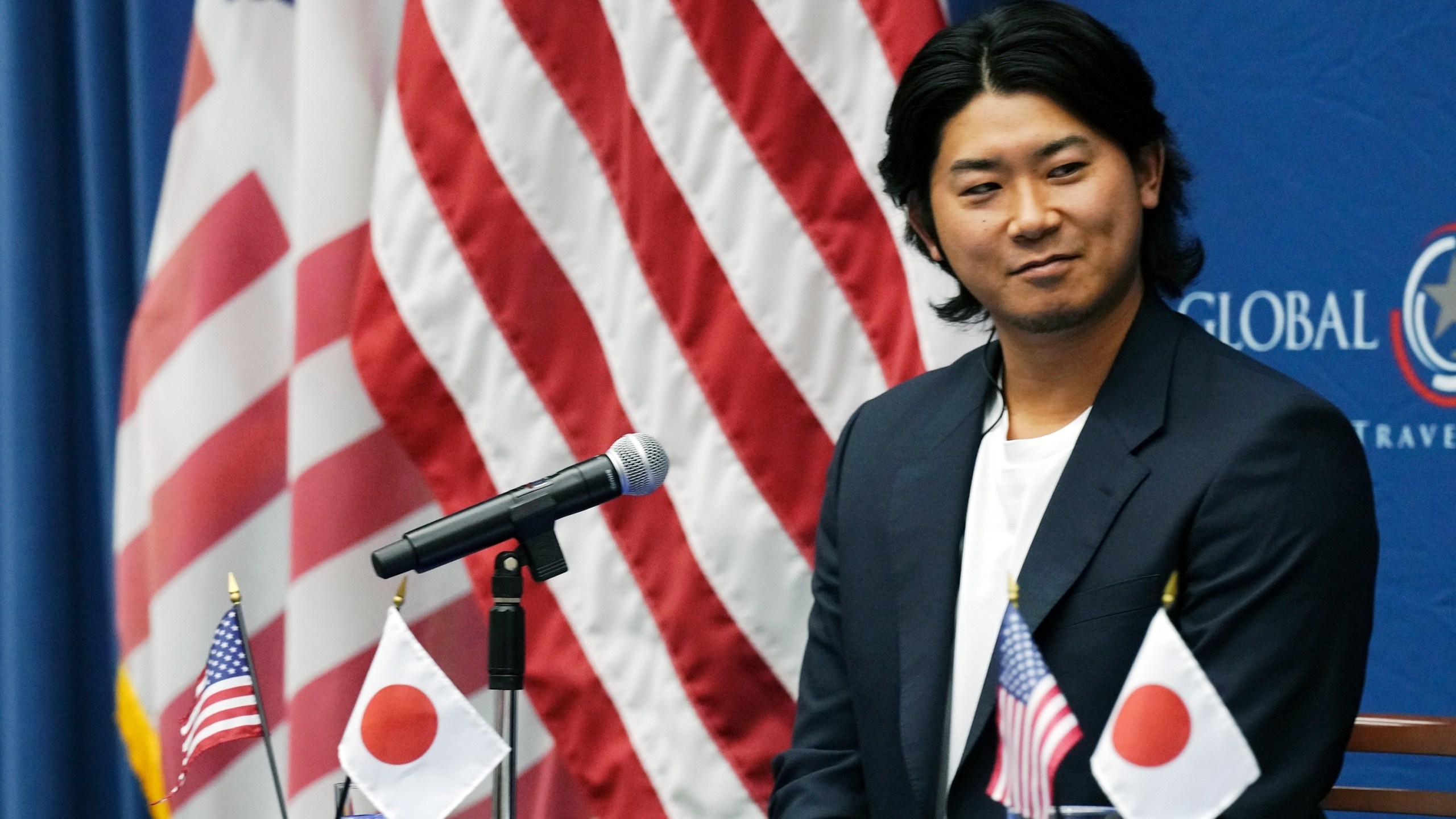 Shota Imanaga, a Japanese pitcher of the Chicago Cubs, smiles during a news conference at the U.S. Embassy Monday, Dec. 9, 2024, in Tokyo, as he was invited to the event dubbed the U.S. Global Entry to promote a way for travelers to get quicker clearance on arrival. (AP Photo/Eugene Hoshiko)