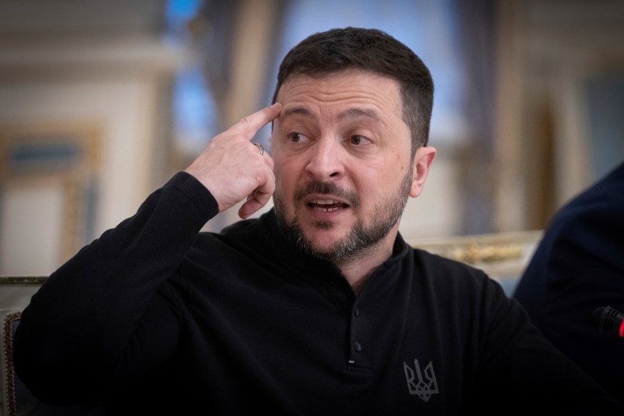 Ukrainian President Volodymyr Zelenskyy talks during his meeting with Chairman of the German Christian Democratic Party (CDU) Friedrich Merz in Kyiv, Ukraine, Monday, Dec. 9, 2024. (AP Photo/Efrem Lukatsky).