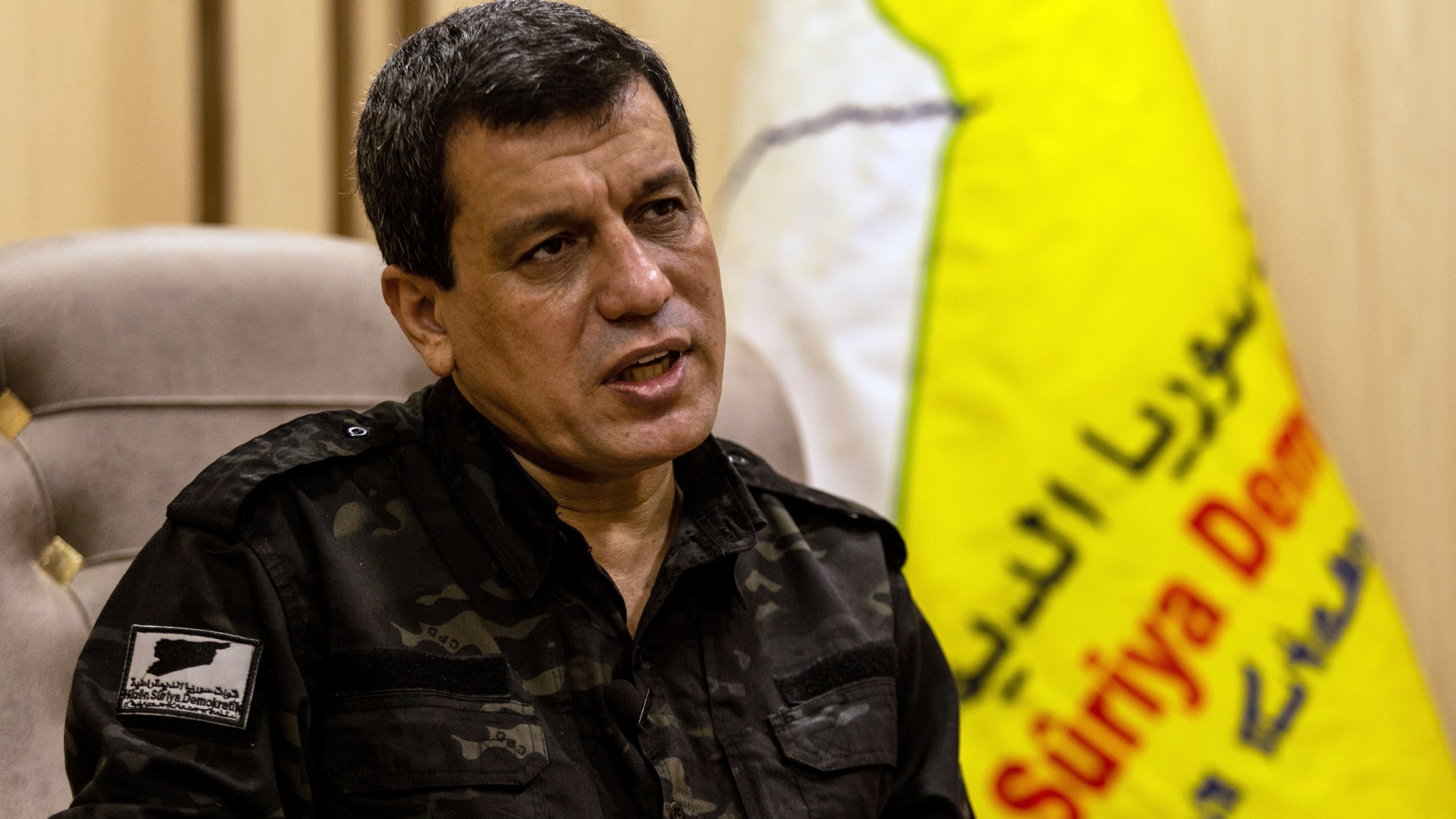 FILE - Mazloum Abdi, the commander of the U.S.-backed Syrian Democratic Forces, speaks during a news conference in Hassakeh, Syria, Nov. 26, 2022. (AP Photo/Baderkhan Ahmad, File)