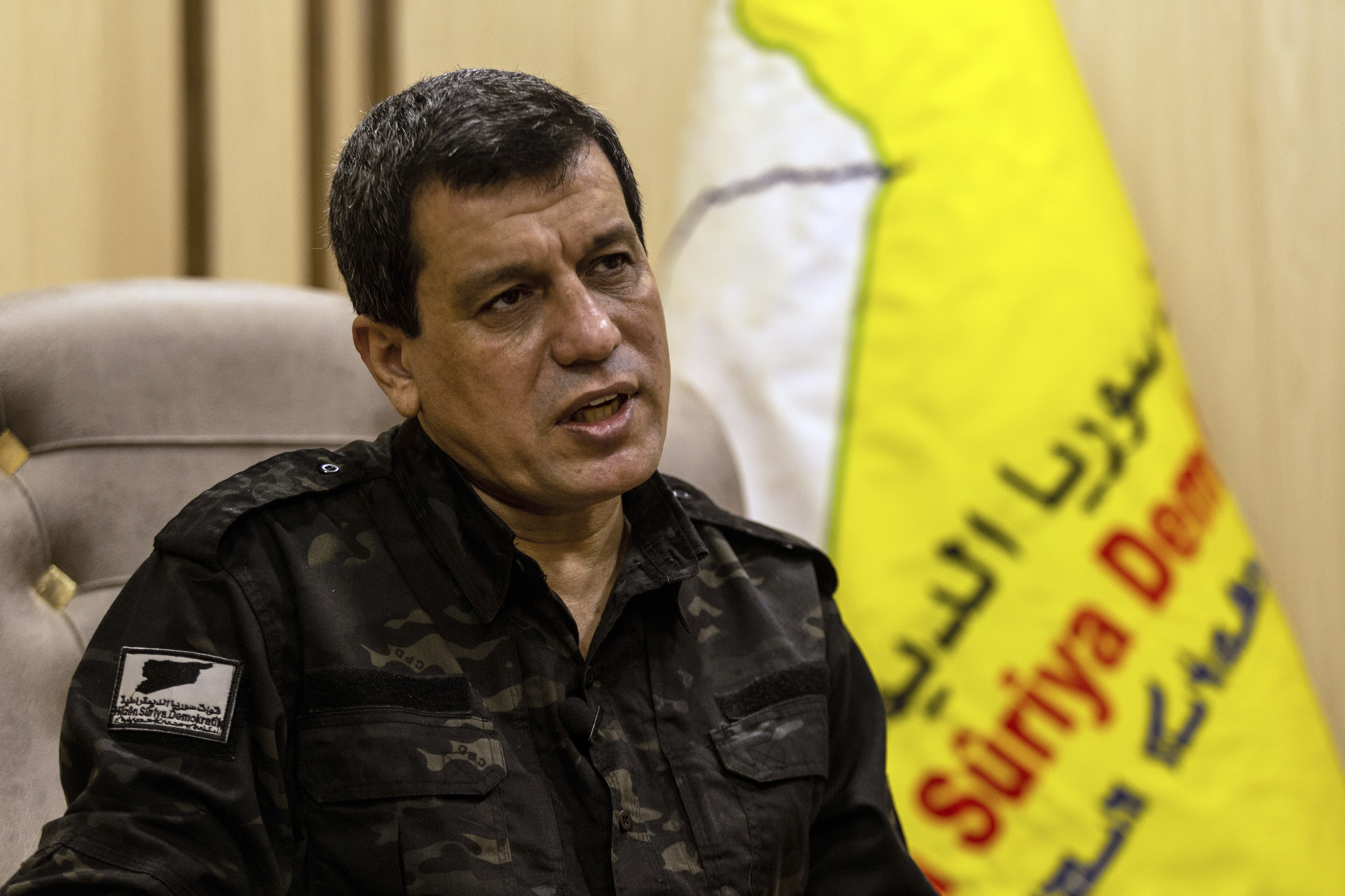 FILE - Mazloum Abdi, the commander of the U.S.-backed Syrian Democratic Forces, speaks during a news conference in Hassakeh, Syria, Nov. 26, 2022. (AP Photo/Baderkhan Ahmad, File)