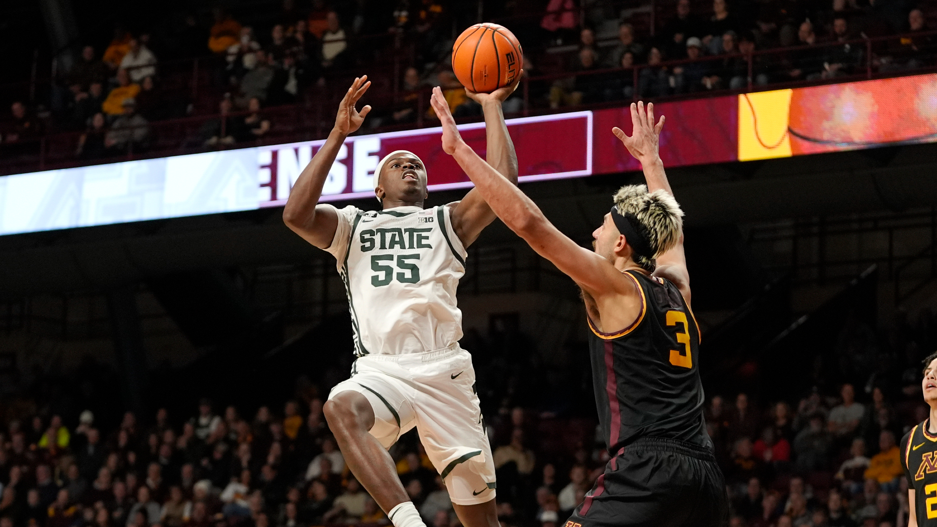 Michigan State forward Coen Carr shoots over Minnesota forward Dawson Garcia on Dec. 4, 2024, in Minneapolis. (Abbie Parr/AP)