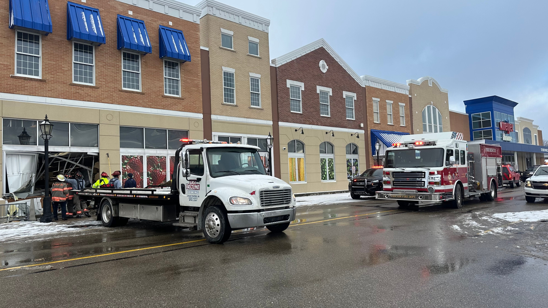 Crews work to remove a car from the Cascade Township Meijer following a crash on Dec. 5, 2024.