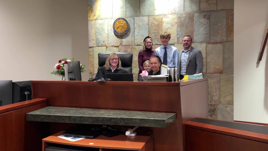 The Irvine family smiles after son Tyson is adopted by stepfather Doug. (Dec. 5, 2024)