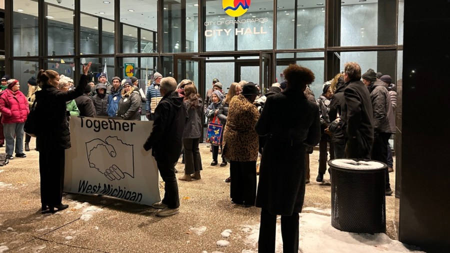 The group Together West Michigan gathers outside Grand Rapids City Hall on Dec. 3, 2024, to voice their objections to an incentives package for a proposed high-rise development.